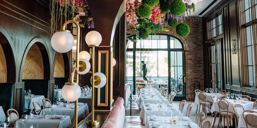 Elegant restaurant interior with floral decor.